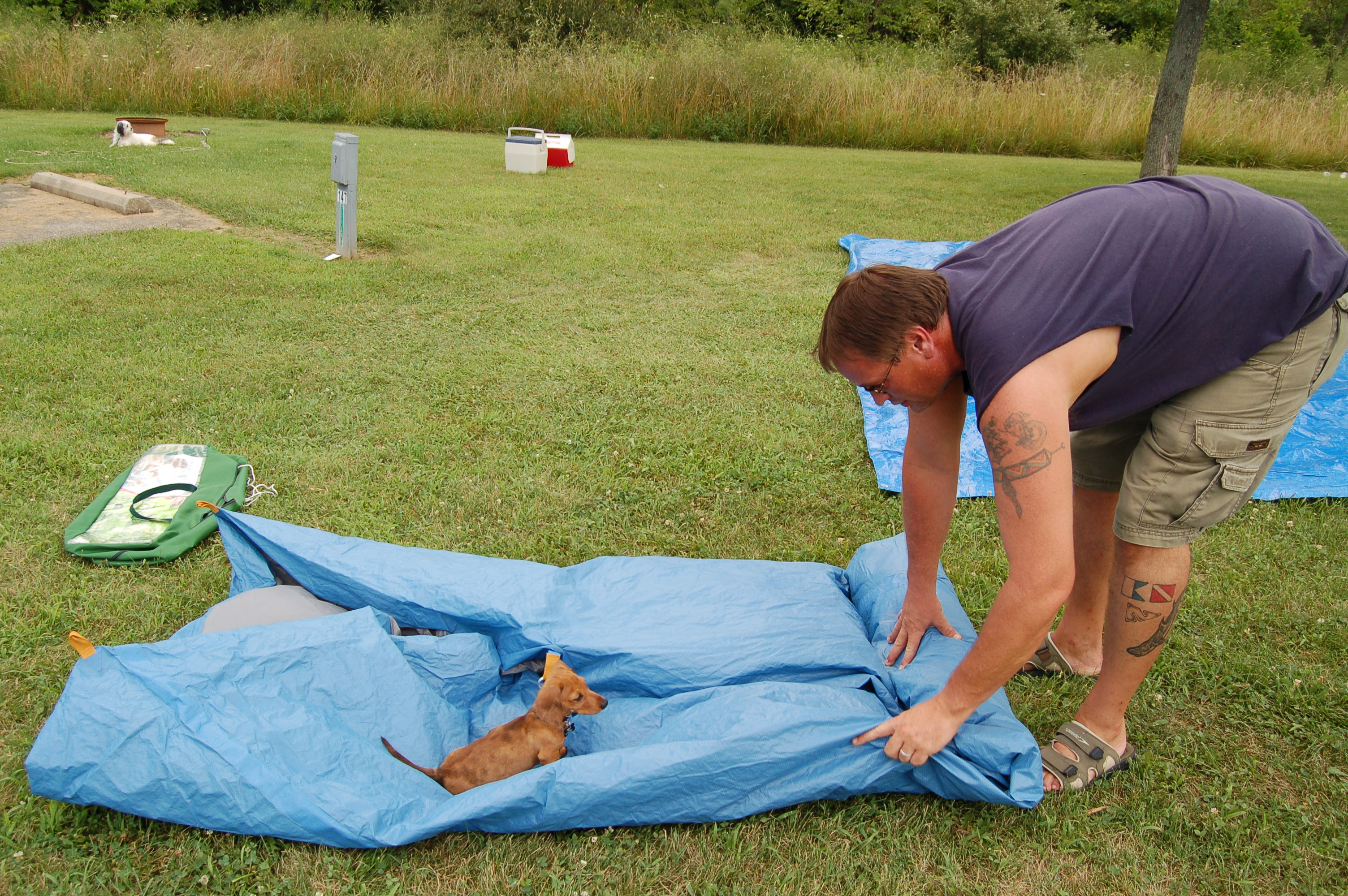 Trying to roll up the tent